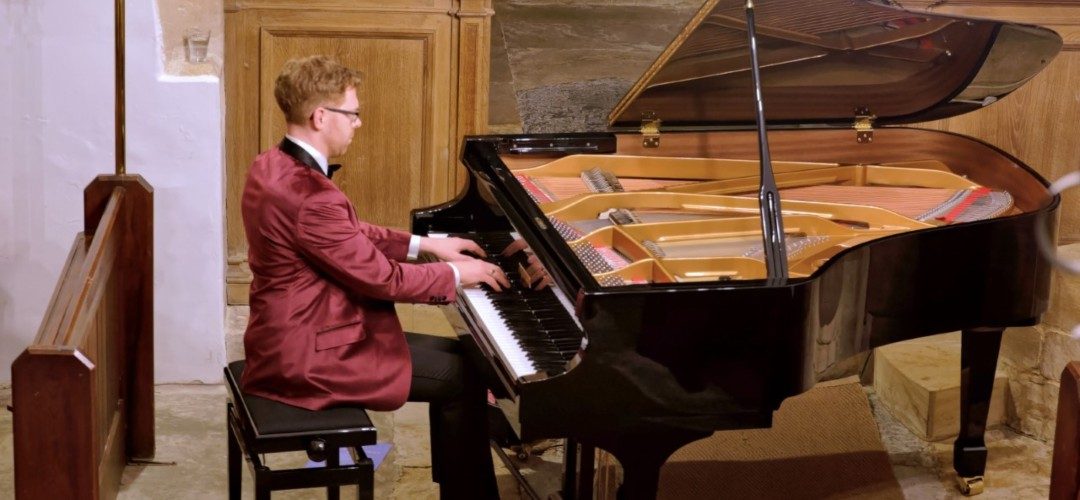 Jonathan Delbridge Playing piano